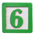 Green wooden block with the number 6 painted on it.