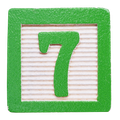 Green wooden block with the number 7.