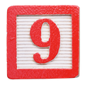 Red wooden block with the number 9 in red.