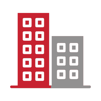 A red building and a gray building are sitting next to each other on a white background.