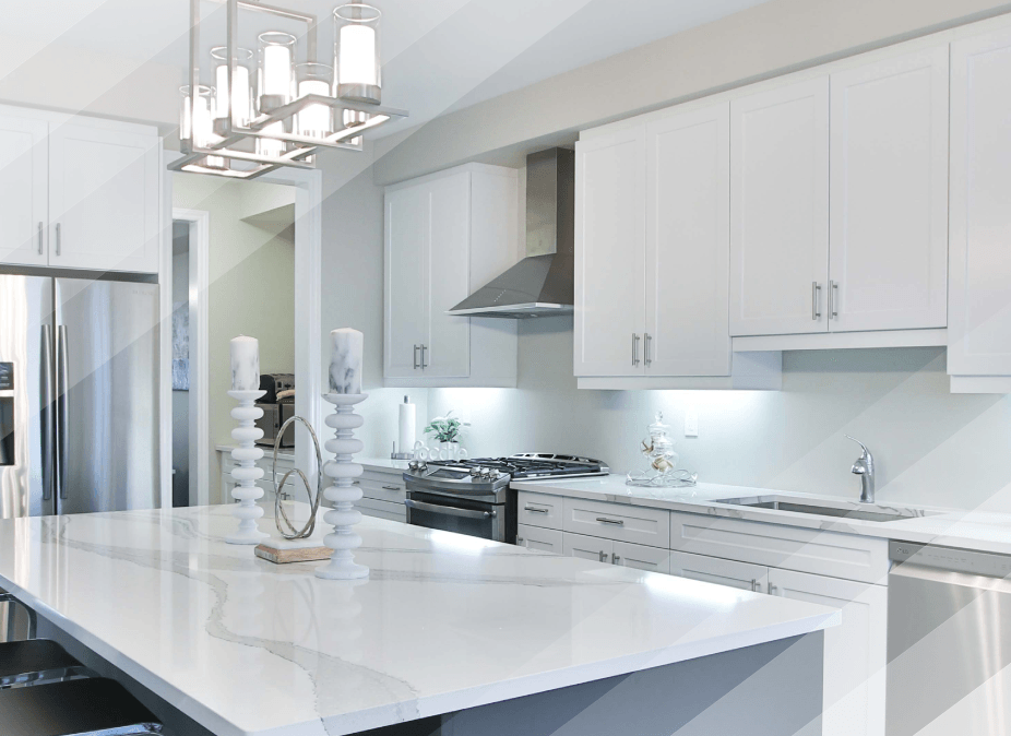 A kitchen with white cabinets and white counter tops