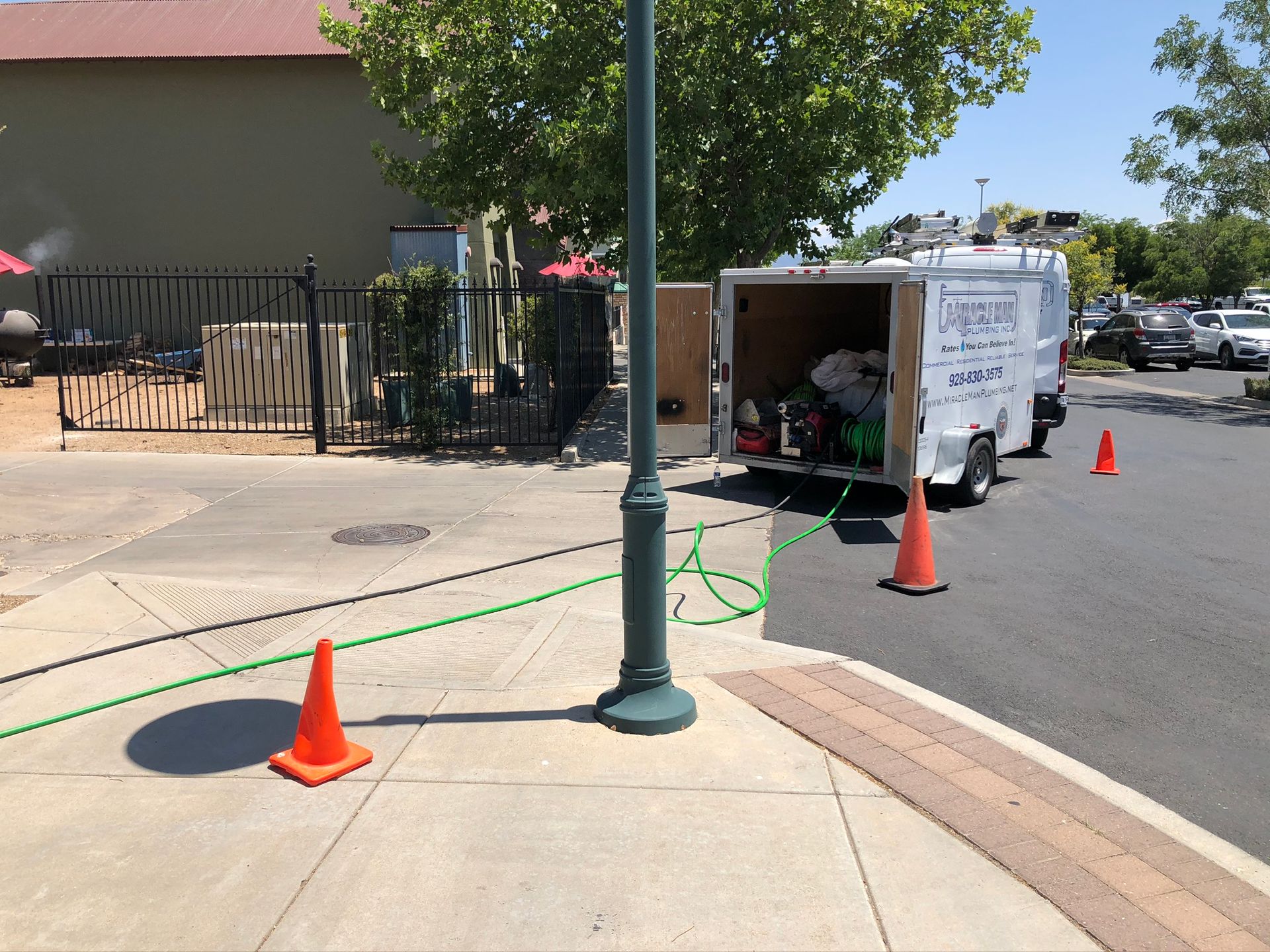A white van is parked on the side of the road