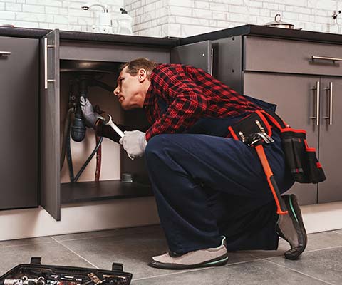 Plumber Inspecting the Sink Pipes | Derry, NH | Derry Plumbing & Heating