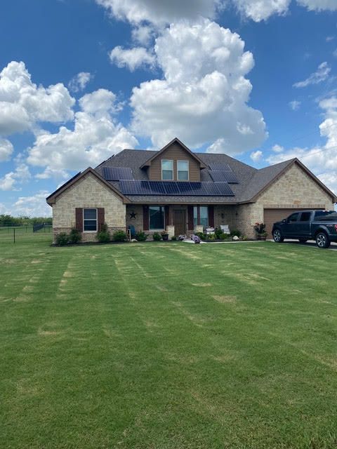 A large house with a truck parked in front of it