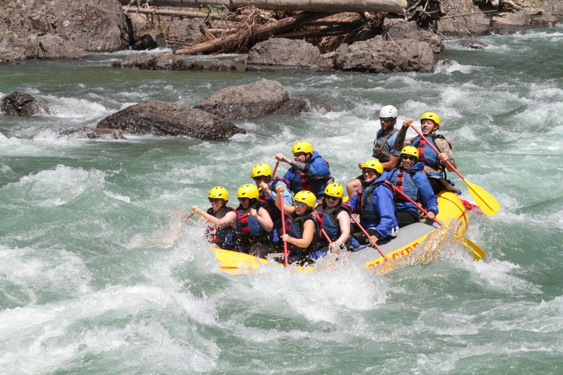 A group of people are rafting down a river.