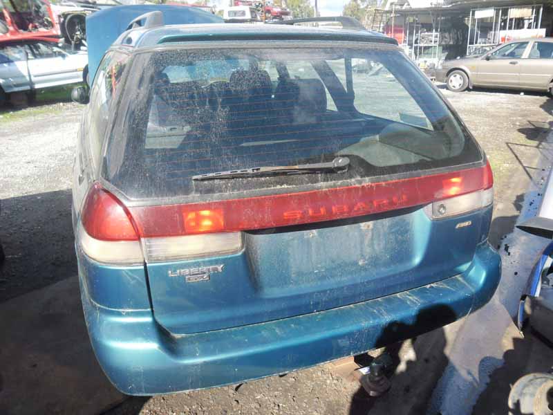 turquoise car with dirt