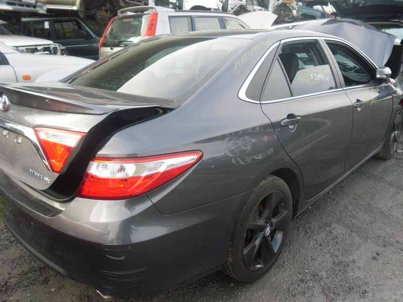 dark grey car with open trunk