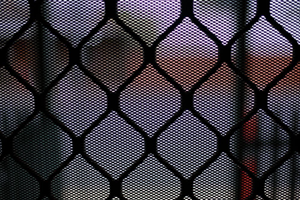 A Close-up View of a Black Metal Security Mesh Grille — Channel Glazing In Electrona, TAS