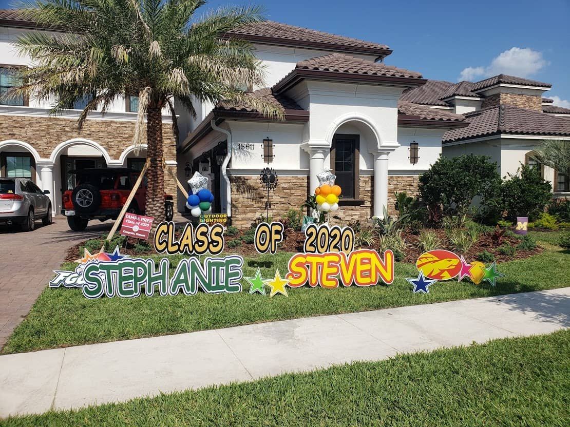 A house with a sign in front of it that says `` class of 2020 steven ''.