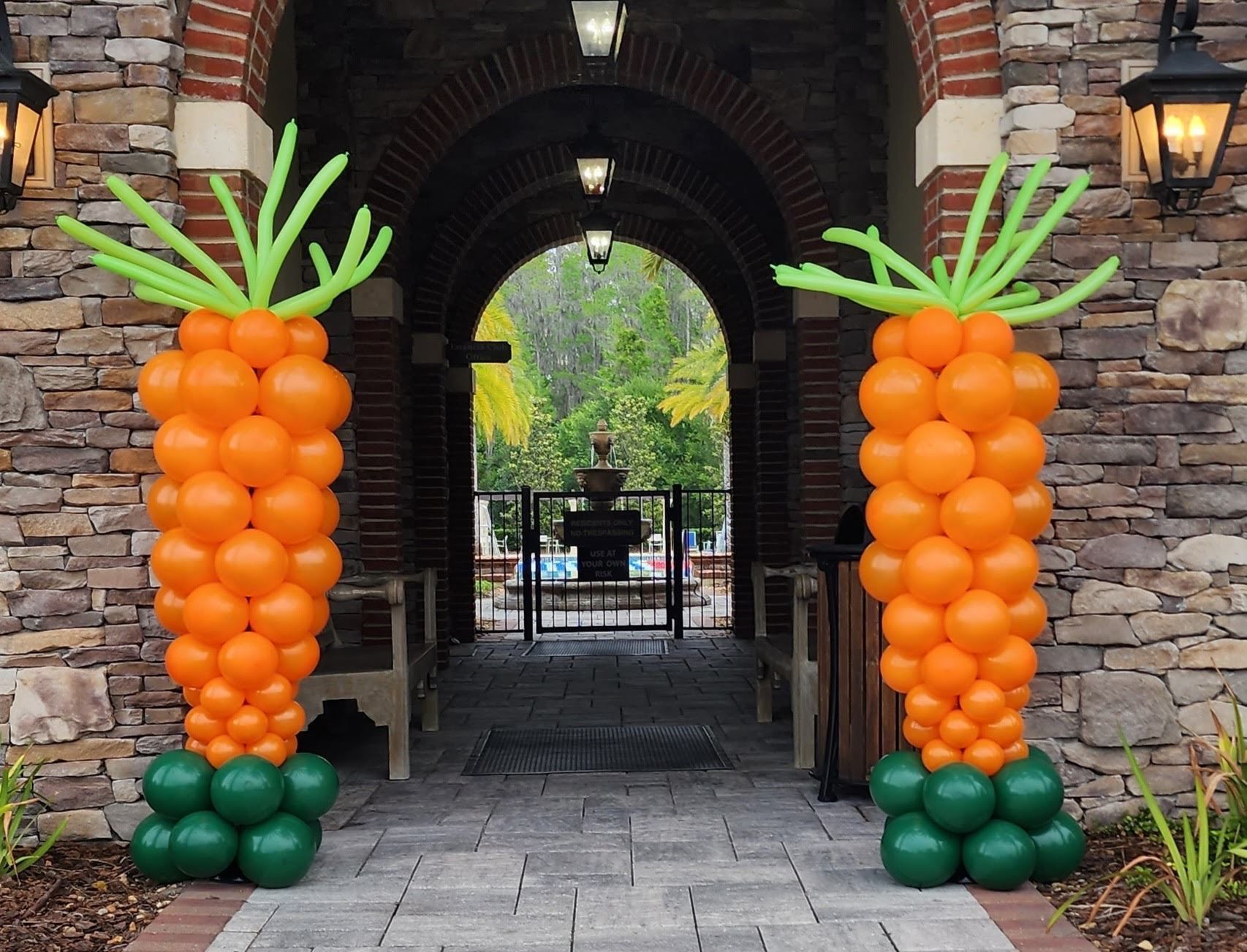 Two columns of balloons in the shape of carrots