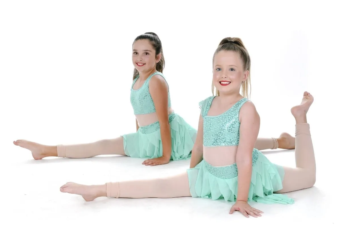 Young Girl Posing And Smiling — Dance Lessons in Medowie, NSW