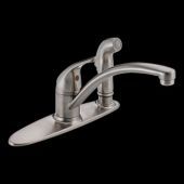 A stainless steel kitchen faucet with a sprayer on a black background.