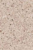 A close up of a beige granite counter top.