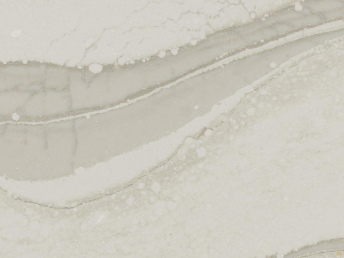 A close up of a white tile with a marble texture.