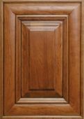 A close up of a wooden cabinet door.