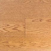 A close up of a wooden floor with a grain pattern.