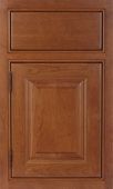 A close up of a wooden cabinet door with a drawer.