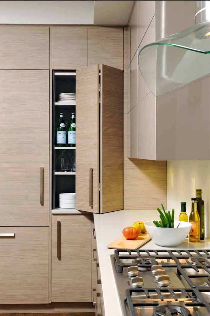 A kitchen with wooden cabinets and a stove top oven