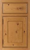 A close up of a wooden cabinet door with a drawer.