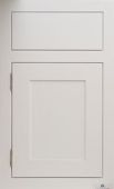 A close up of a white cabinet door on a white wall.