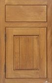 A close up of a wooden cabinet door with a drawer.