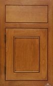 A close up of a wooden cabinet door with a square drawer.