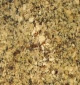 A close up of a pile of crumbs on a table.