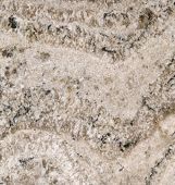 A close up of a white granite counter top.