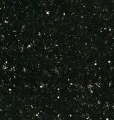 A close up of a black granite counter top with white stars.