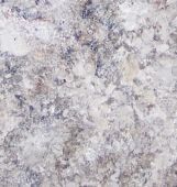 A close up of a white granite counter top.