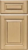 A close up of a tan cabinet door on a white background.