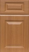A close up of a wooden cabinet door.