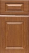 A close up of a wooden cabinet door with drawers.
