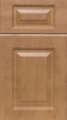A close up of a wooden cabinet door with drawers.