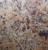 A close up of a granite counter top with a marble texture.