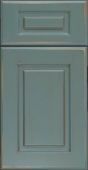 A close up of a blue cabinet door on a white background.