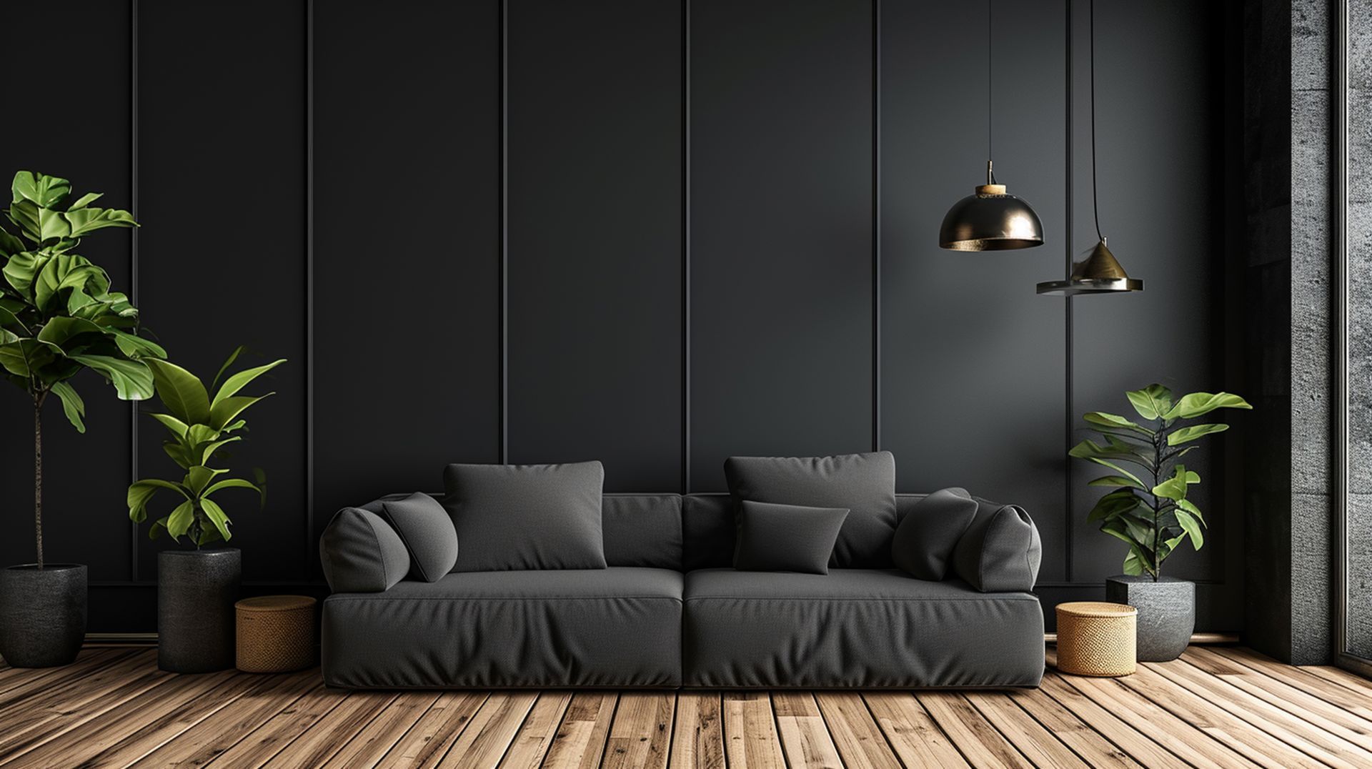 A living room with a black couch and black walls.