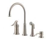 A stainless steel kitchen sink faucet with a sprayer and soap dispenser.