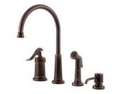 A kitchen sink faucet with a sprayer and soap dispenser.