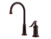 A kitchen faucet with a sprayer attached to it on a white background.