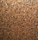 A close up of a brown granite counter top.