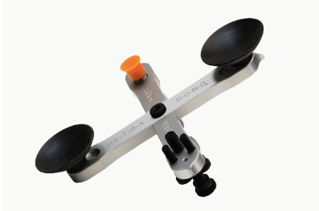 A tool with two suction cups on a white background