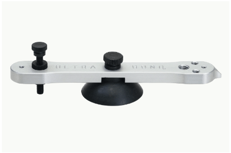 A metal tool with a suction cup on a white background.