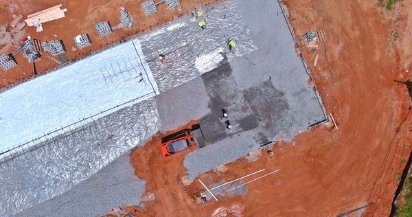 an aerial view of a construction site with workers