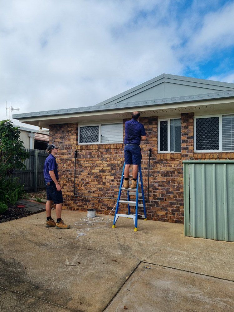 Electricians Working On House — Electricians In Bundaberg, QLD