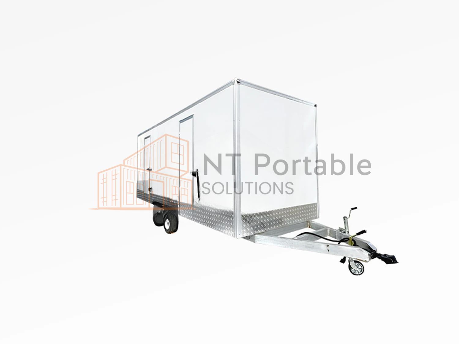 White portable restroom trailer on a trailer hitch, with the words 