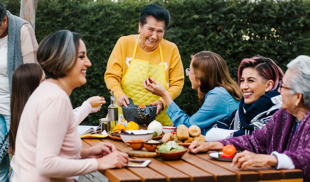 woman having a barbeque with her family