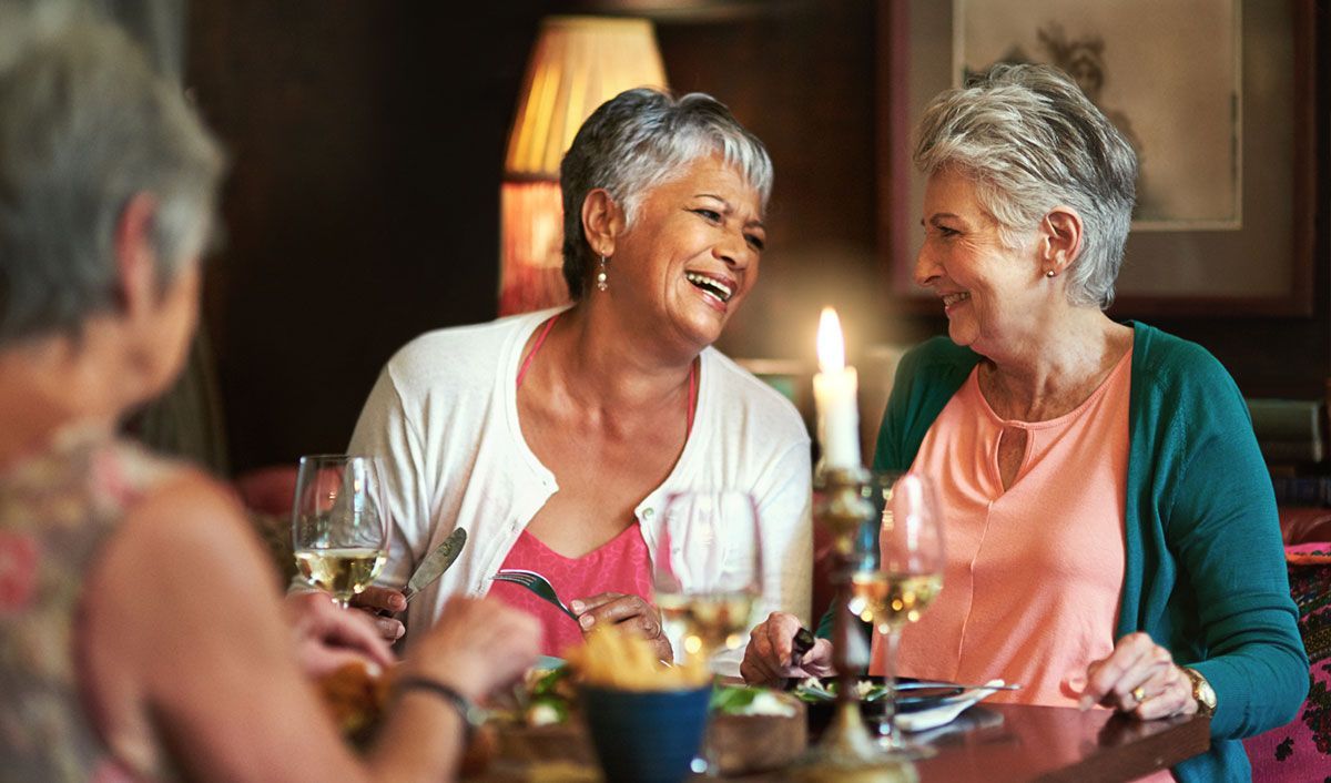 elderly women having a chat over dinner
