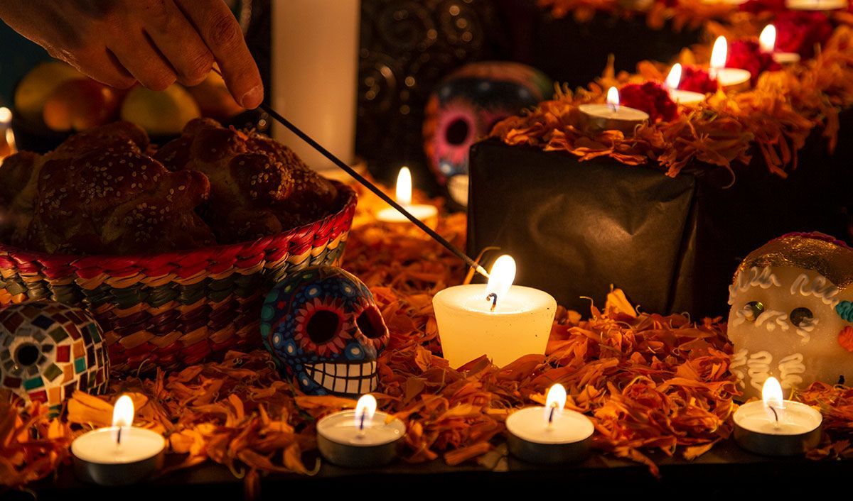 Candles and sugar skulls set out for the Dia de los Muertos celebration