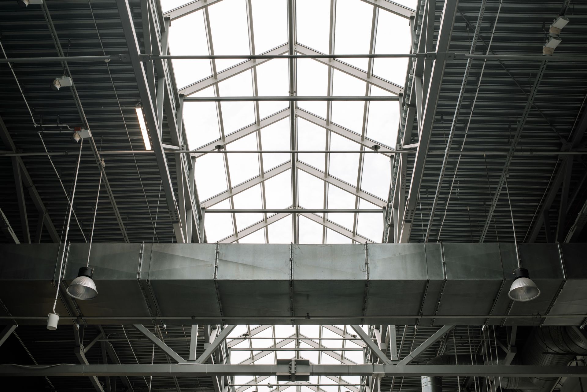 Looking up at the ceiling of a building with a skylight.